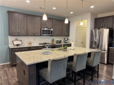 This stunning end-unit townhome in the Magnolia Green community on The Westham Golf Club At Magnolia Green in Virginia - for sale on GolfHomes.com, golf home, golf lot