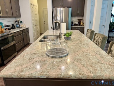 This stunning end-unit townhome in the Magnolia Green community on The Westham Golf Club At Magnolia Green in Virginia - for sale on GolfHomes.com, golf home, golf lot