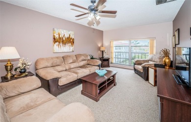 This 2-bedroom, 1.5-bath condo comes fully furnished and on The Dunedin Country Club in Florida - for sale on GolfHomes.com, golf home, golf lot