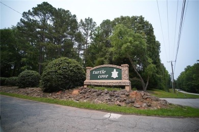 Dive into lakeside luxury at its finest in the heart of Turtle on Turtle Cove Golf Course in Georgia - for sale on GolfHomes.com, golf home, golf lot