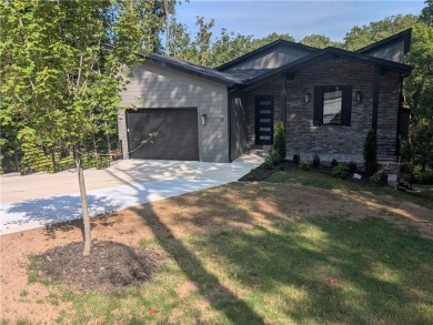 Discover luxury living in this brand-new modern home. The on Bella Vista Country Club and Golf Course in Arkansas - for sale on GolfHomes.com, golf home, golf lot