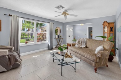 Welcome to this inviting 4-bedroom, 2-bathroom home located in on East Lake Woodlands Country Club in Florida - for sale on GolfHomes.com, golf home, golf lot
