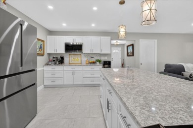 Welcome to this inviting 4-bedroom, 2-bathroom home located in on East Lake Woodlands Country Club in Florida - for sale on GolfHomes.com, golf home, golf lot