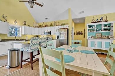 Discover the ultimate coastal retreat in this stunning custom on The Plantation Course At Edisto in South Carolina - for sale on GolfHomes.com, golf home, golf lot