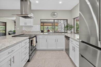 Welcome to this inviting 4-bedroom, 2-bathroom home located in on East Lake Woodlands Country Club in Florida - for sale on GolfHomes.com, golf home, golf lot