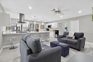 Welcome to this inviting 4-bedroom, 2-bathroom home located in on East Lake Woodlands Country Club in Florida - for sale on GolfHomes.com, golf home, golf lot