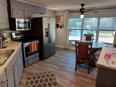 The Lot Rent for this home is $1,047.00/monthly. A cozy on Lake Fairways Country Club in Florida - for sale on GolfHomes.com, golf home, golf lot