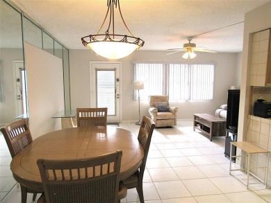 TURNKEY 1 BEDROOM, 1.5 BATHS. TILE IN LIVING AREAS, CARPET IN on Wynmoor Golf Course in Florida - for sale on GolfHomes.com, golf home, golf lot