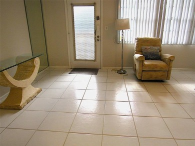 TURNKEY 1 BEDROOM, 1.5 BATHS. TILE IN LIVING AREAS, CARPET IN on Wynmoor Golf Course in Florida - for sale on GolfHomes.com, golf home, golf lot