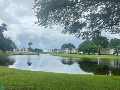 Welcome home to this RARE 1 bdrm, 2 full bath condo on the FIRST on Hillsboro Pines Golf in Florida - for sale on GolfHomes.com, golf home, golf lot