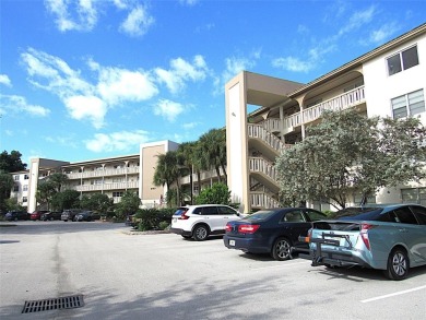 TURNKEY 1 BEDROOM, 1.5 BATHS. TILE IN LIVING AREAS, CARPET IN on Wynmoor Golf Course in Florida - for sale on GolfHomes.com, golf home, golf lot