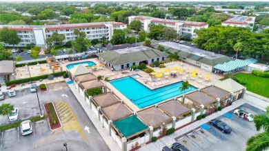 TURNKEY 1 BEDROOM, 1.5 BATHS. TILE IN LIVING AREAS, CARPET IN on Wynmoor Golf Course in Florida - for sale on GolfHomes.com, golf home, golf lot