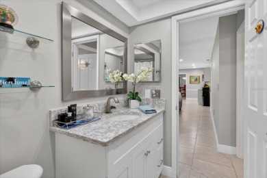 Welcome to this inviting 4-bedroom, 2-bathroom home located in on East Lake Woodlands Country Club in Florida - for sale on GolfHomes.com, golf home, golf lot