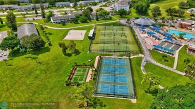 Welcome home to this RARE 1 bdrm, 2 full bath condo on the FIRST on Hillsboro Pines Golf in Florida - for sale on GolfHomes.com, golf home, golf lot