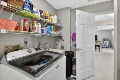 Welcome to this inviting 4-bedroom, 2-bathroom home located in on East Lake Woodlands Country Club in Florida - for sale on GolfHomes.com, golf home, golf lot
