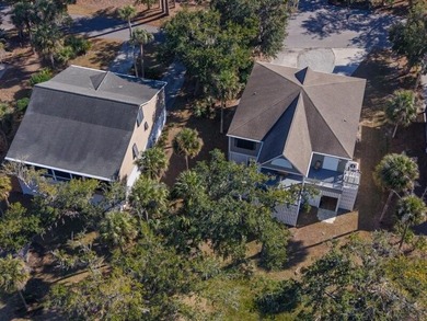 Discover the ultimate coastal retreat in this stunning custom on The Plantation Course At Edisto in South Carolina - for sale on GolfHomes.com, golf home, golf lot