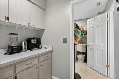 Welcome to this inviting 4-bedroom, 2-bathroom home located in on East Lake Woodlands Country Club in Florida - for sale on GolfHomes.com, golf home, golf lot