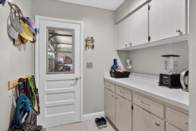 Welcome to this inviting 4-bedroom, 2-bathroom home located in on East Lake Woodlands Country Club in Florida - for sale on GolfHomes.com, golf home, golf lot