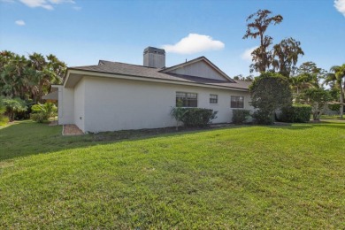 Welcome to this inviting 4-bedroom, 2-bathroom home located in on East Lake Woodlands Country Club in Florida - for sale on GolfHomes.com, golf home, golf lot