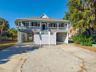 Discover the ultimate coastal retreat in this stunning custom on The Plantation Course At Edisto in South Carolina - for sale on GolfHomes.com, golf home, golf lot