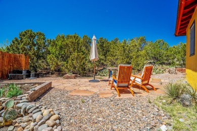 Nestled privately among Pinon and Juniper trees at Cochiti Lake on Pueblo de Cochiti Golf Course in New Mexico - for sale on GolfHomes.com, golf home, golf lot