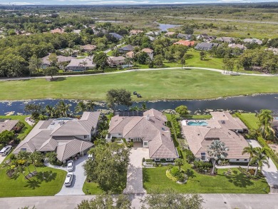 Experience luxury living on the 8th hole of the Match Course in on PGA National Golf Club in Florida - for sale on GolfHomes.com, golf home, golf lot