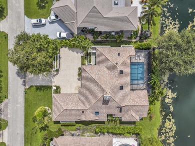 Experience luxury living on the 8th hole of the Match Course in on PGA National Golf Club in Florida - for sale on GolfHomes.com, golf home, golf lot
