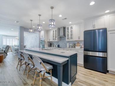 Surround yourself in tasteful luxury in this beautifully on Oceans Golf Club in Florida - for sale on GolfHomes.com, golf home, golf lot