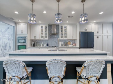 Surround yourself in tasteful luxury in this beautifully on Oceans Golf Club in Florida - for sale on GolfHomes.com, golf home, golf lot