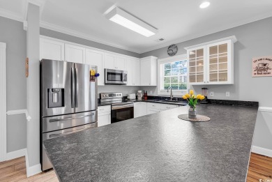This furnished 3-bedroom, 2-bath condo offers beach living at on Myrtlewood Golf Course and Club  in South Carolina - for sale on GolfHomes.com, golf home, golf lot