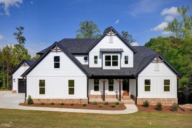 Enjoy all the perks of this modern farmhouse plan located in on Summergrove Golf Club in Georgia - for sale on GolfHomes.com, golf home, golf lot