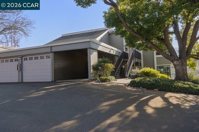 Lower level SIERRA condo in sought after lagoon entry E1 on Rossmoor Golf Course in California - for sale on GolfHomes.com, golf home, golf lot