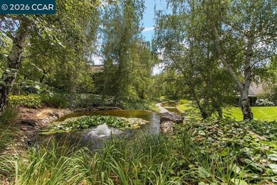 Lower level SIERRA condo in sought after lagoon entry E1 on Rossmoor Golf Course in California - for sale on GolfHomes.com, golf home, golf lot