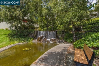 Lower level SIERRA condo in sought after lagoon entry E1 on Rossmoor Golf Course in California - for sale on GolfHomes.com, golf home, golf lot