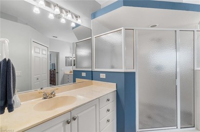 Second-floor end unit with a peaceful lake view and extra on The Club At Grandezza in Florida - for sale on GolfHomes.com, golf home, golf lot