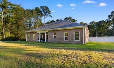 Welcome to this stunning all-brick home nestled on a private 1 on Wachesaw Plantation Club in South Carolina - for sale on GolfHomes.com, golf home, golf lot