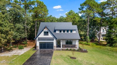 Stunning new construction in the desirable and gated community on Carolina National Golf Club in North Carolina - for sale on GolfHomes.com, golf home, golf lot