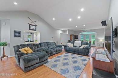 This beautiful home, across from a pretty pond, is located along on Lockwood Folly Country Club in North Carolina - for sale on GolfHomes.com, golf home, golf lot