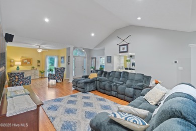 This beautiful home, across from a pretty pond, is located along on Lockwood Folly Country Club in North Carolina - for sale on GolfHomes.com, golf home, golf lot