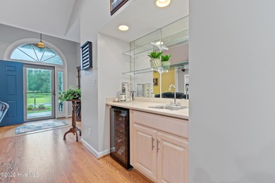 This beautiful home, across from a pretty pond, is located along on Lockwood Folly Country Club in North Carolina - for sale on GolfHomes.com, golf home, golf lot