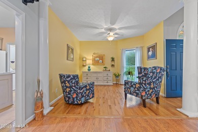 This beautiful home, across from a pretty pond, is located along on Lockwood Folly Country Club in North Carolina - for sale on GolfHomes.com, golf home, golf lot