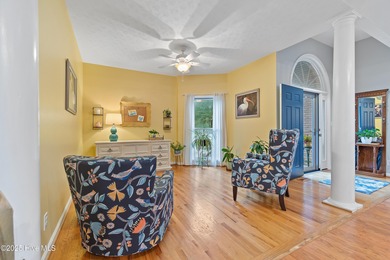 This beautiful home, across from a pretty pond, is located along on Lockwood Folly Country Club in North Carolina - for sale on GolfHomes.com, golf home, golf lot