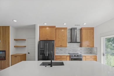 Discover modern living at its finest at 85 Rountree, located on Bella Vista Country Club - Berksdale in Arkansas - for sale on GolfHomes.com, golf home, golf lot