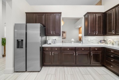 Experience timeless elegance and effortless living in this on BallenIsles Golf and Country Club in Florida - for sale on GolfHomes.com, golf home, golf lot