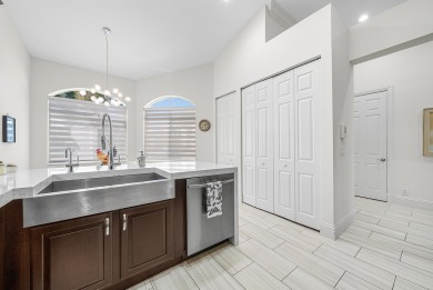 Experience timeless elegance and effortless living in this on BallenIsles Golf and Country Club in Florida - for sale on GolfHomes.com, golf home, golf lot