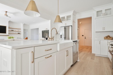 Welcome to your ideal coastal retreat! This beautiful 1.5 story on Crow Creek Golf Club in North Carolina - for sale on GolfHomes.com, golf home, golf lot