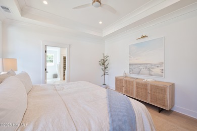 Welcome to your ideal coastal retreat! This beautiful 1.5 story on Crow Creek Golf Club in North Carolina - for sale on GolfHomes.com, golf home, golf lot