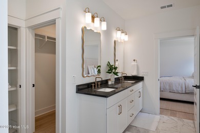 Welcome to your ideal coastal retreat! This beautiful 1.5 story on Crow Creek Golf Club in North Carolina - for sale on GolfHomes.com, golf home, golf lot