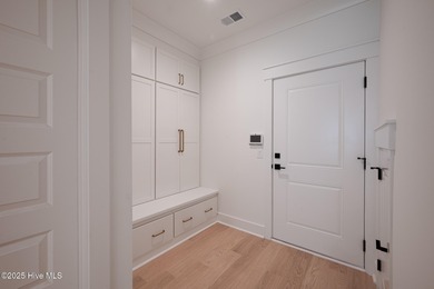 Welcome to your ideal coastal retreat! This beautiful 1.5 story on Crow Creek Golf Club in North Carolina - for sale on GolfHomes.com, golf home, golf lot