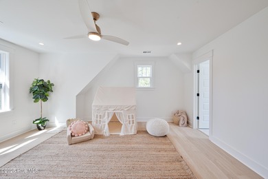 Welcome to your ideal coastal retreat! This beautiful 1.5 story on Crow Creek Golf Club in North Carolina - for sale on GolfHomes.com, golf home, golf lot